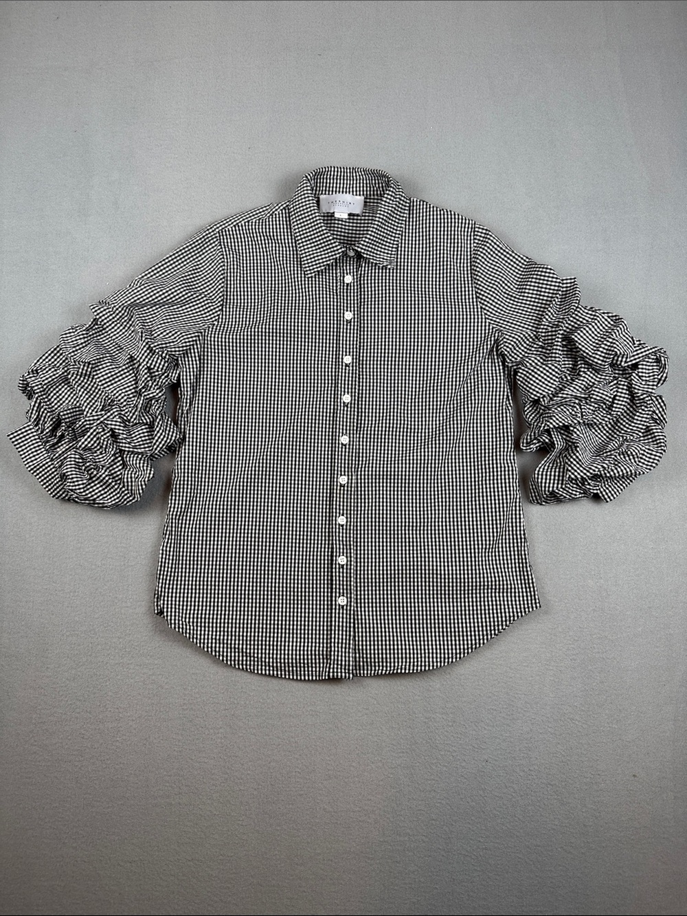 The Shirt Rochelle Behrens Black/White Gingham Ruffled Sleeve Shirt
Size: Large